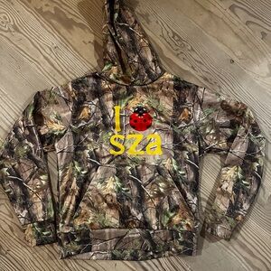 Camouflage “I heart SZA” Tour Hoodie with Ladybug Graphic